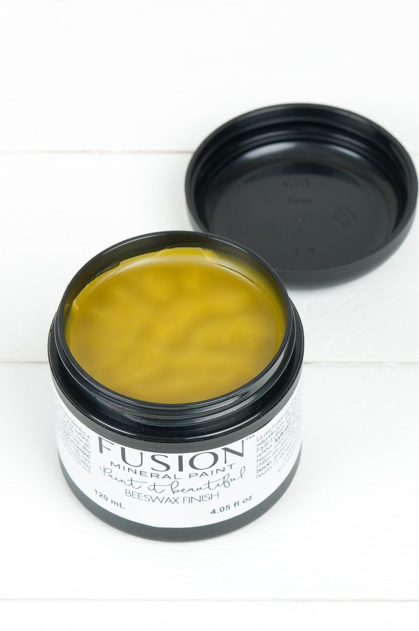 opened pot of Fusion Beeswax Finish. Showing a yellow shiny natural soft wax