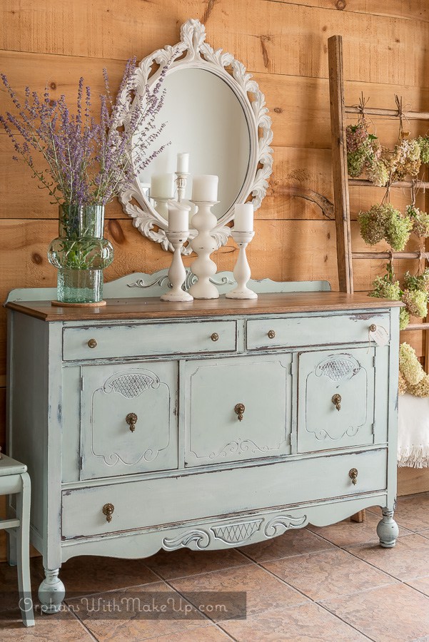 Buffet Sideboard with reclaimed wood ladder . This buffet is painted in Inglenook from Fusion Mineral Paint. This rustic distressed french country chic look is a beautiful farmhouse style.