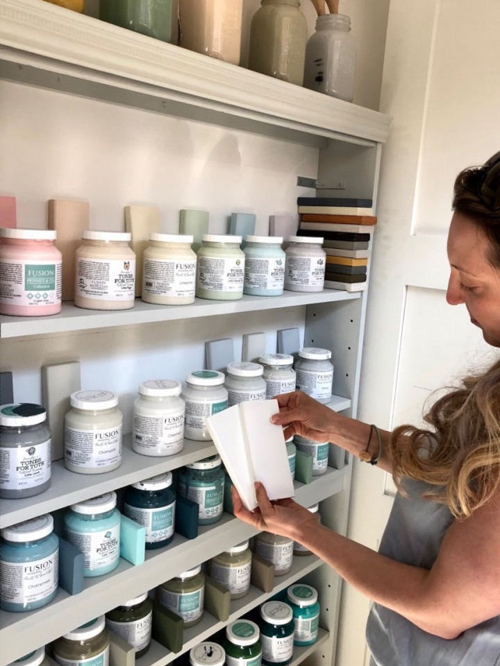 woman holding paint samples