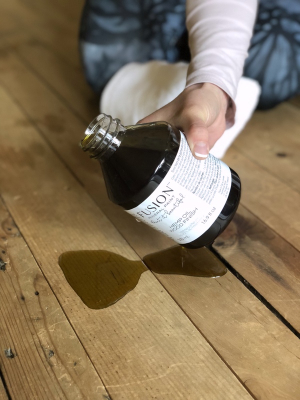 bottle of hemp oil being poured out