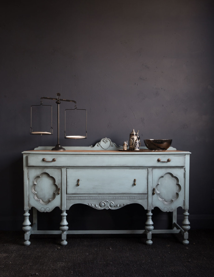 Sideboard painted champness and blaxk wax against dark grey wall