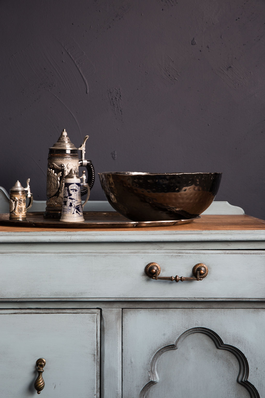 close up of a corner sideboard painted in Fusion Champness and black wax