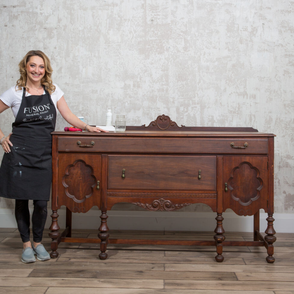 Jennylyn Pringle with brown before sideboard and supplies.