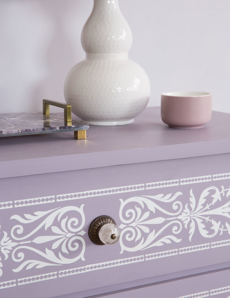 Close up of Raised pearl embossed stencil on Lavender painted laminate dresser