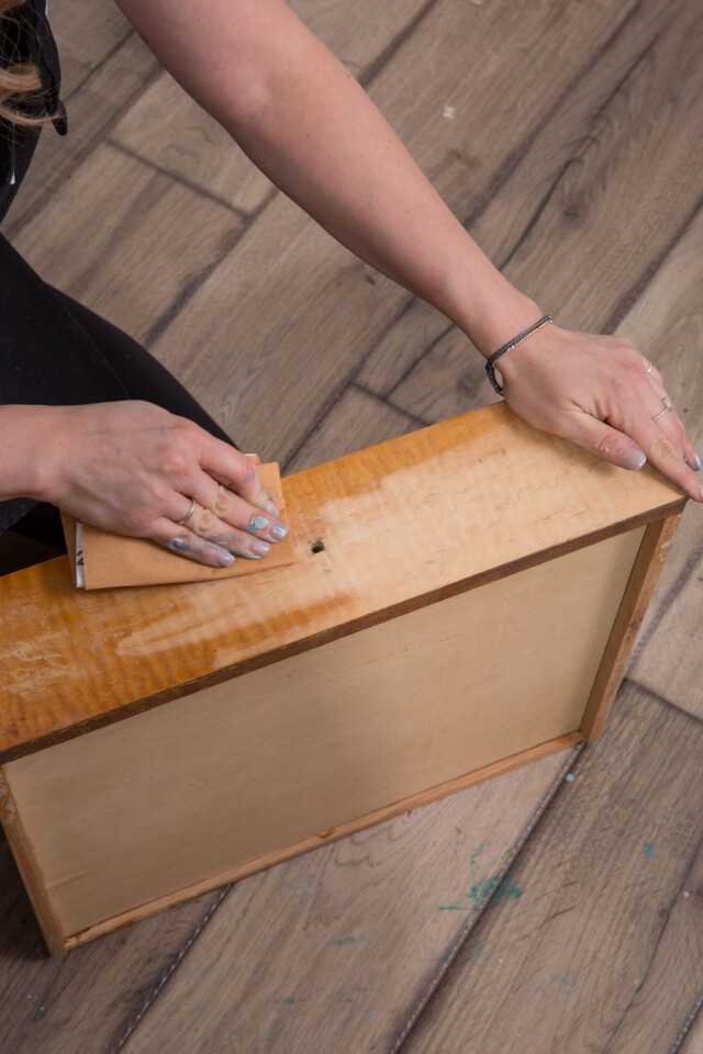 Sanding old finish off drawers