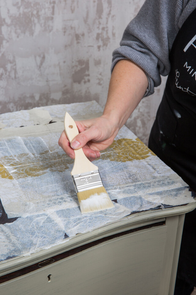 Decoupage and transfer gel being applied as a top coat.