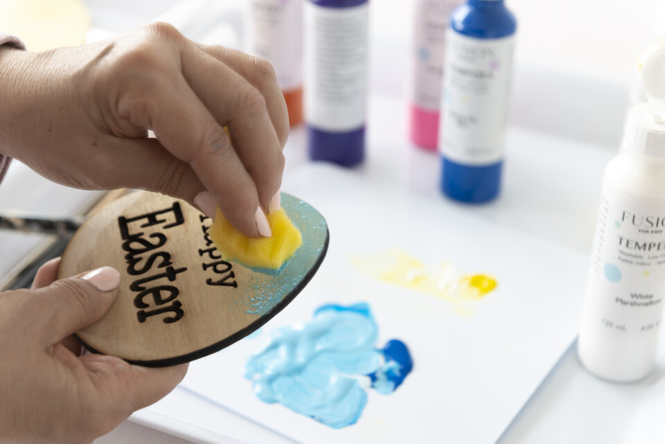 an egg being painted 