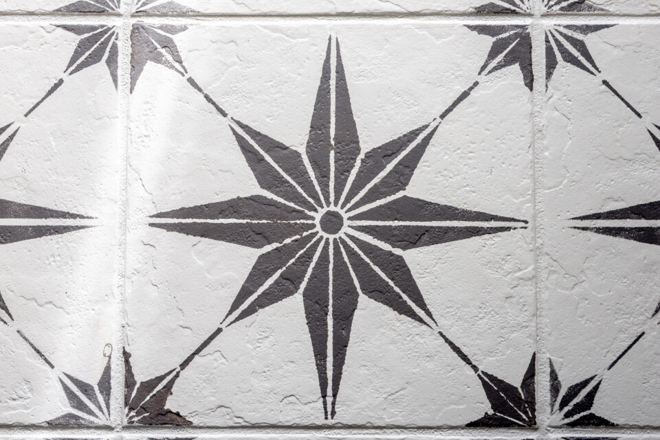 Close up of stenciled image on tiled floor