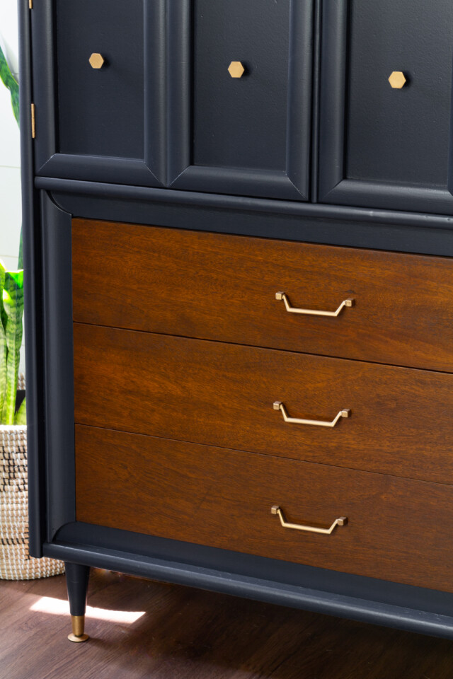 Close up image of dresser drawers, stained natural wood