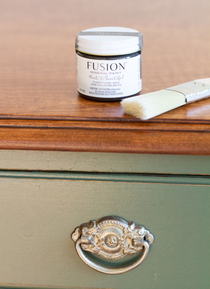 Jar of fusion furniture wax sitting on top of painted dresser