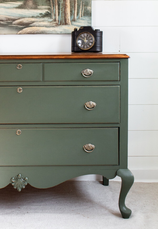 Staged dresser painted in bayberry, vintage clock sitting on top of dresser