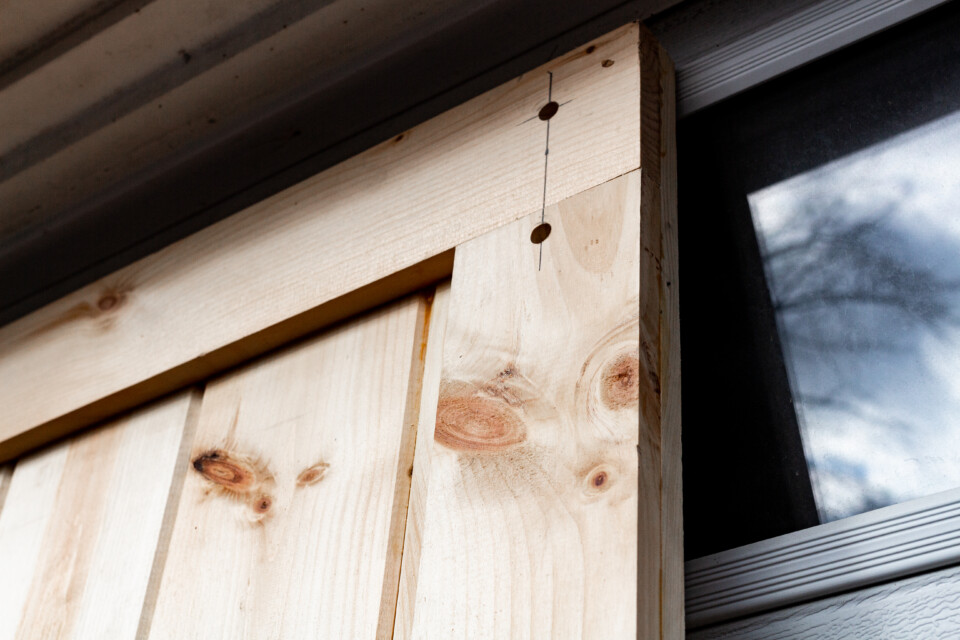 Pine door with pre drilled holes for mounting