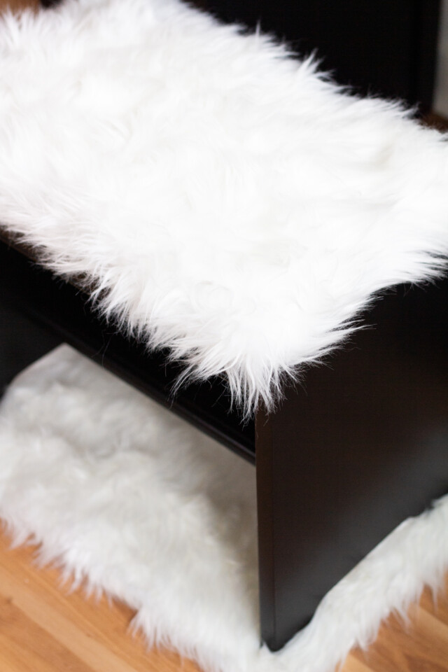 Close up image of faux fur lined bench