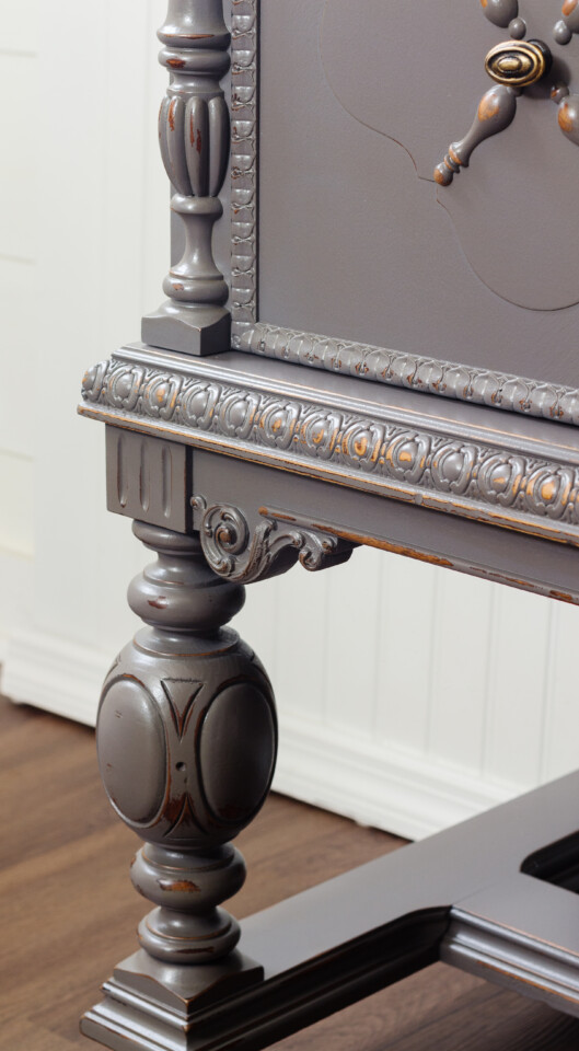 Up close image of Jacobean buffet showing off the distressed edges and cleaned hardware
