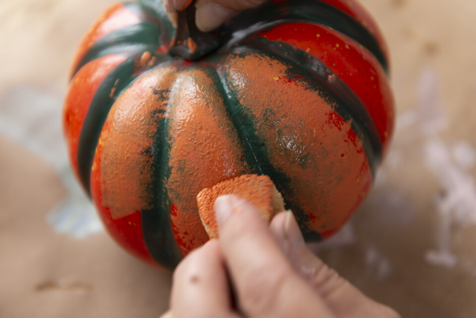 Dabbing tuscan orange fmp onto plastic pumpkin