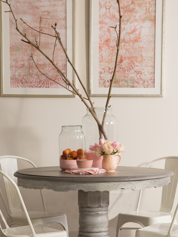 Staged dining room table with pink decor