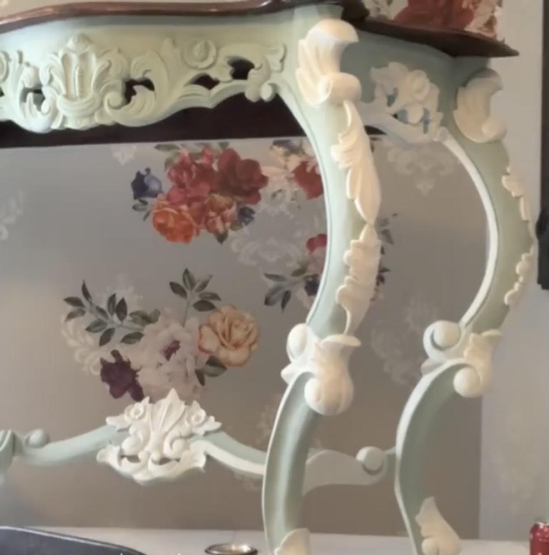 White paint on the carvings of the console table 