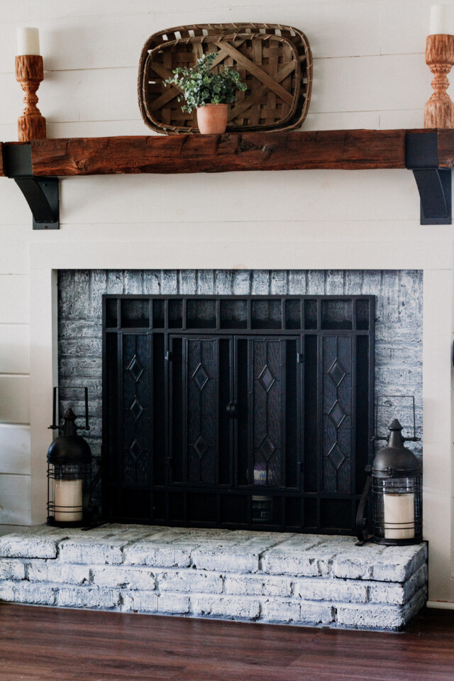 black fireplace with grey brick