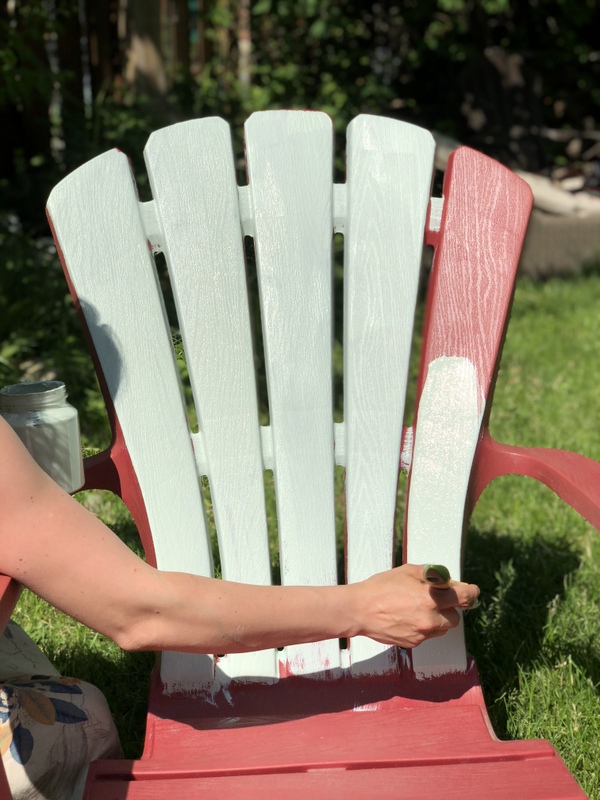 Muskoka chair being painted in inglenook