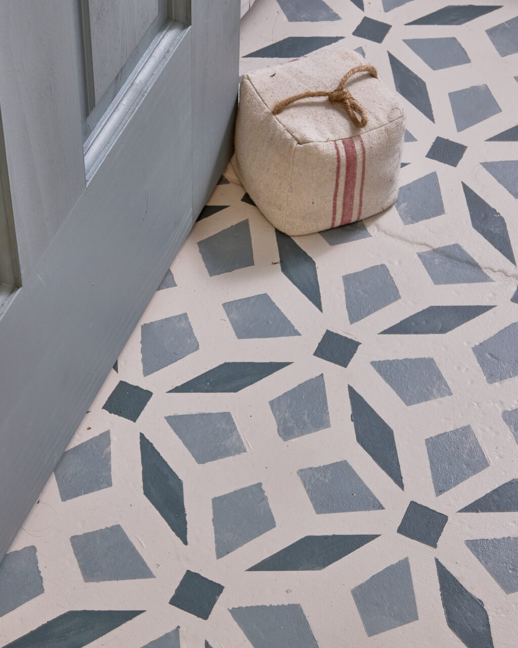 Blue stencilled bathroom tile floor