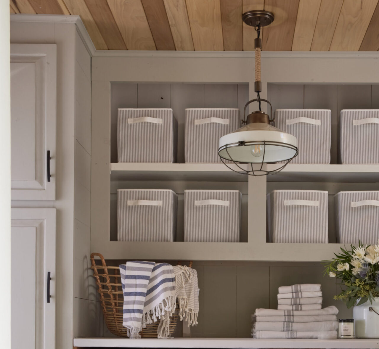  Cosy cottage / Close up image of shelves and cabinets in laundry room