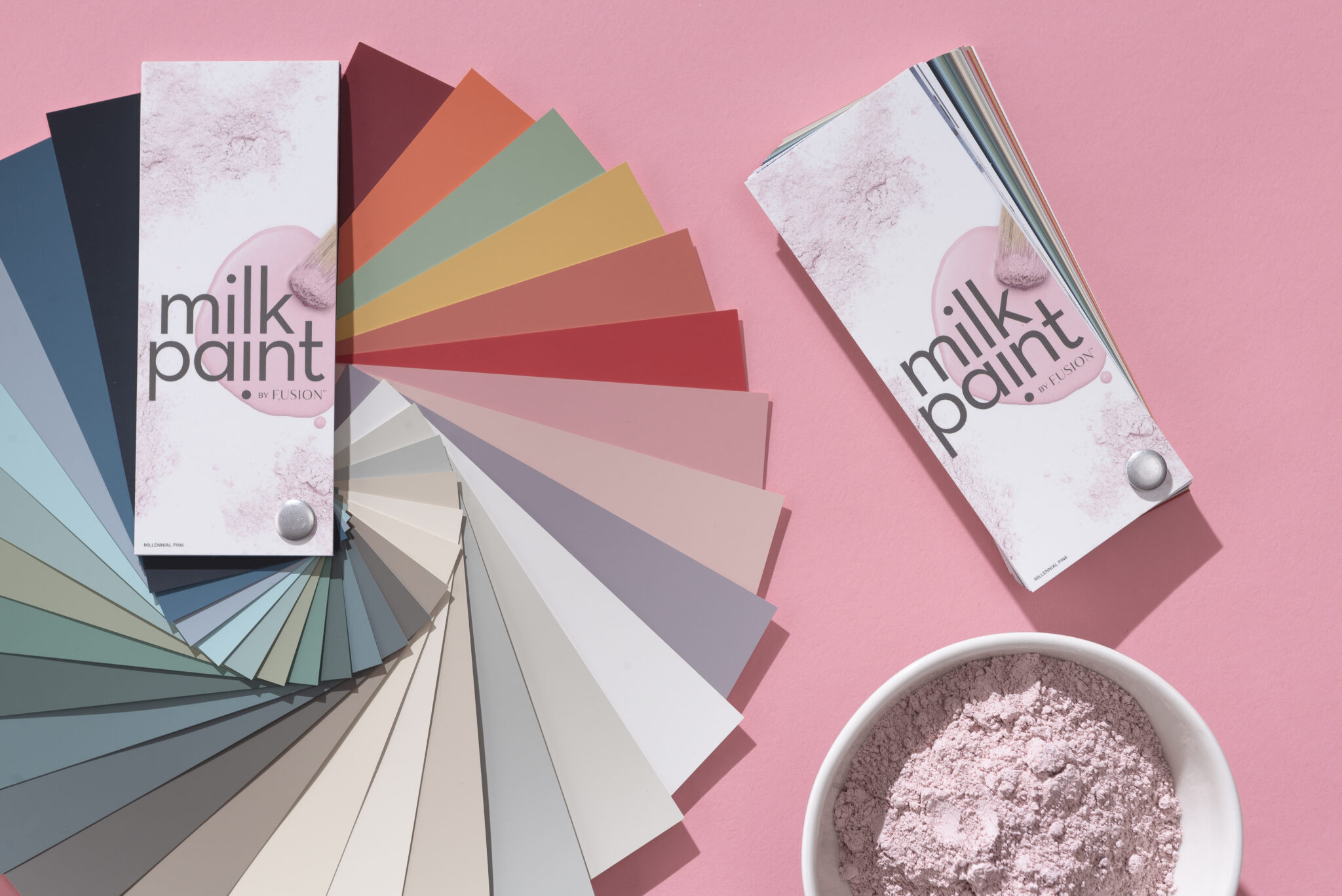 Fusion Milk Paint fan deck on a pink background