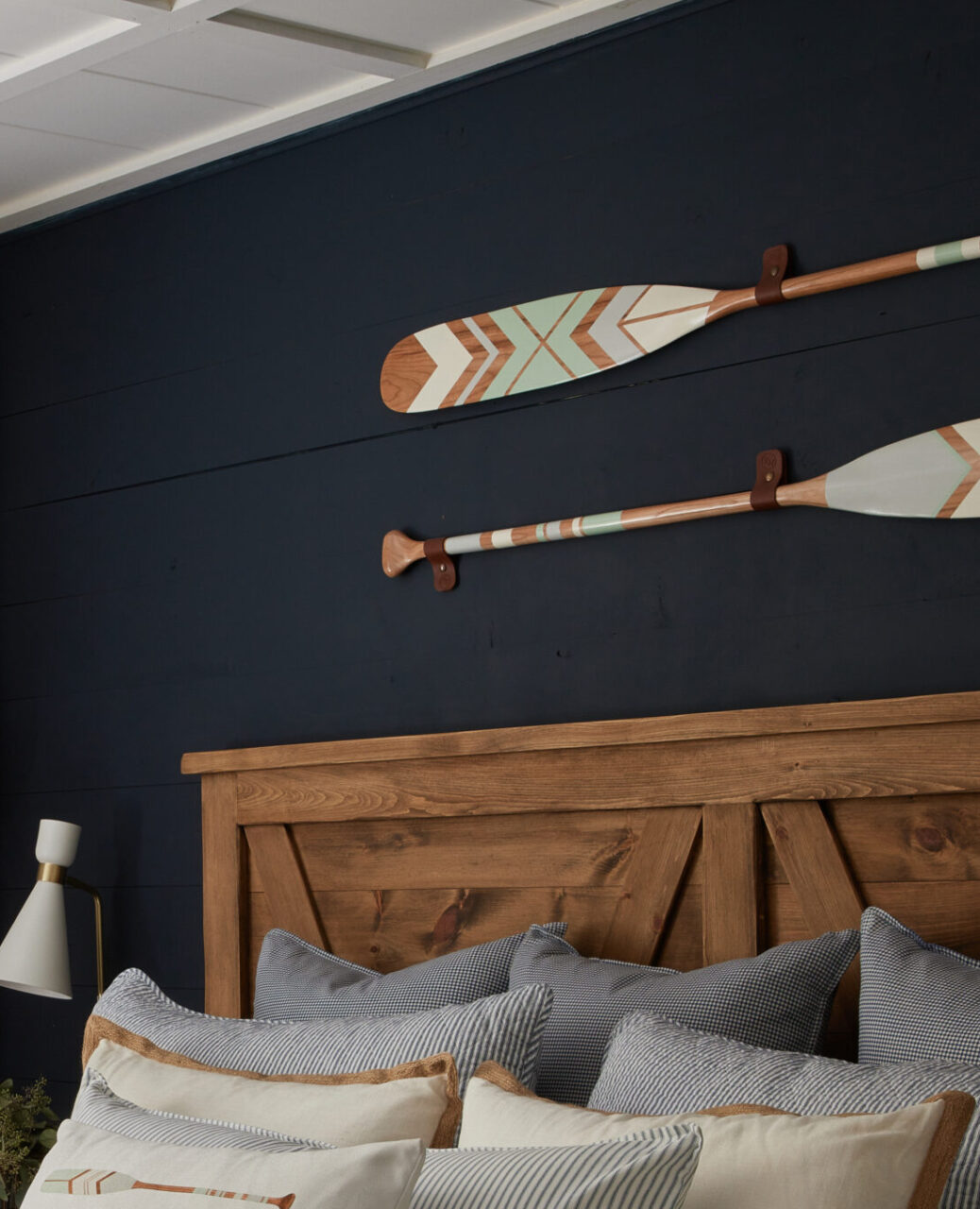 The Nautical Room  / paddles hanging above bed painted in pastel colours and natural wood 