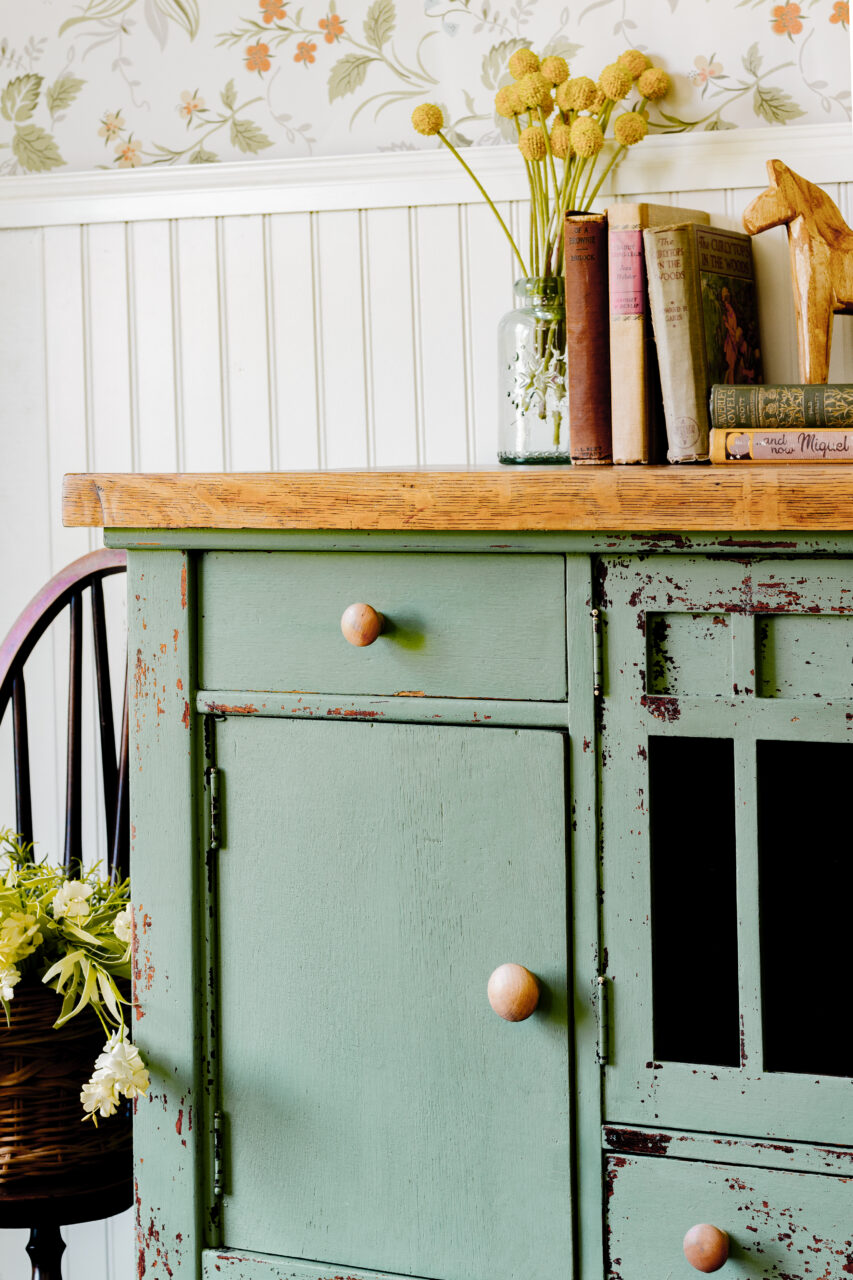 Staged cabinet painted in Stockholm Green a New HH Milk Paint Colour