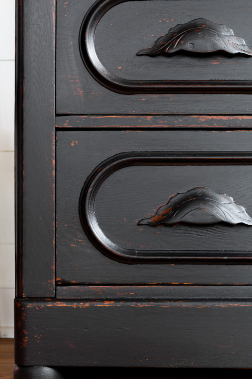 corner shot of coal black painted dresser