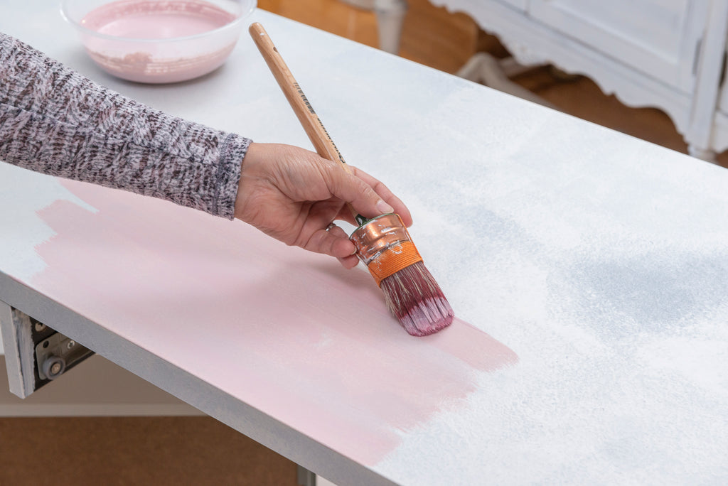 painting on millenial pink milk paint for the Ikea Micke Desk Makeover