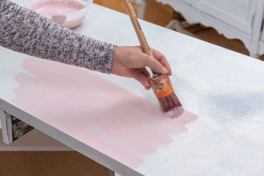 painting on millenial pink milk paint for the Ikea Micke Desk Makeover
